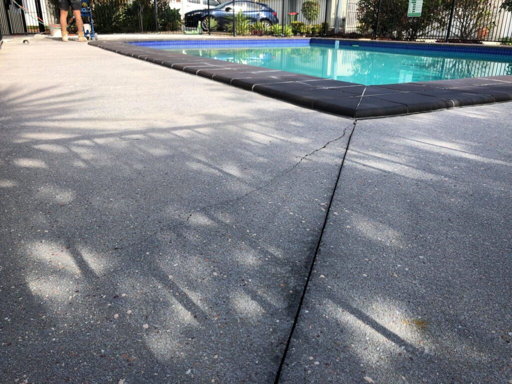 Before photo of cracked pool surround